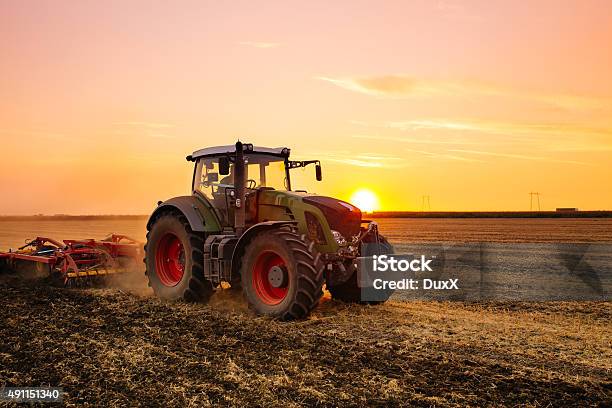 Tractor On The Field Stock Photo - Download Image Now - Tractor, Farm, Agriculture