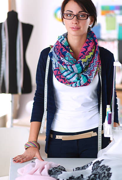 istock Beautiful fashion designer standing in studio 491152188