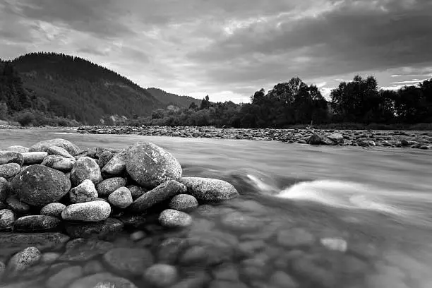 Mountain river Dunajec waterfall landscape black and white.South Poland.