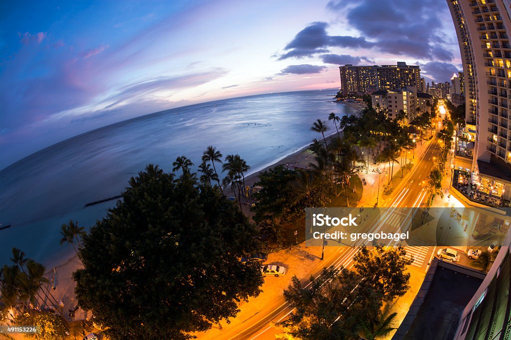 Waikiki Beach and Kalakaua Avenue in Honolulu, HI at night Fisheye view of Waikiki Beach and Kalakaua Avenue in Honolulu, HI at night. 2015 Stock Photo