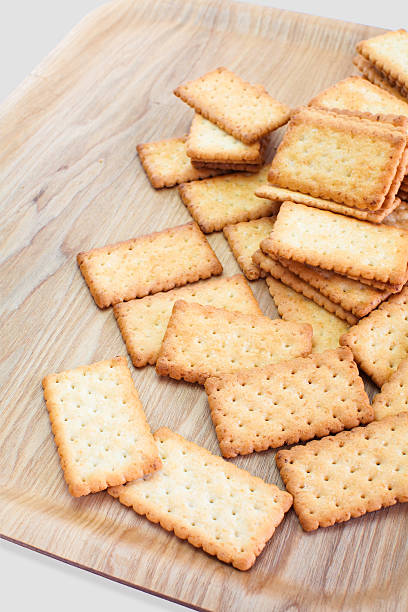 istock Stack of Coconut biscuit in brown wood trey 491166920