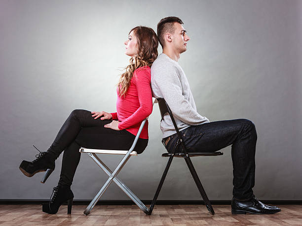istock Young couple after quarrel sitting back to back 491167256