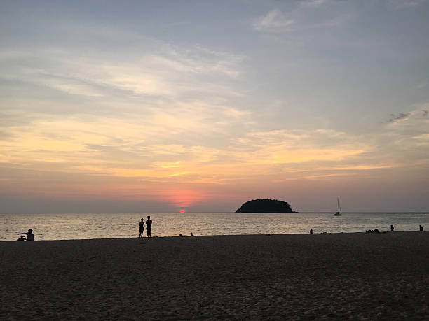 istock Kata beach sunset with tourists 491168972