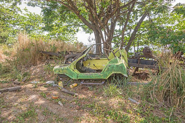 istock Old rusted car in the forest 491171182