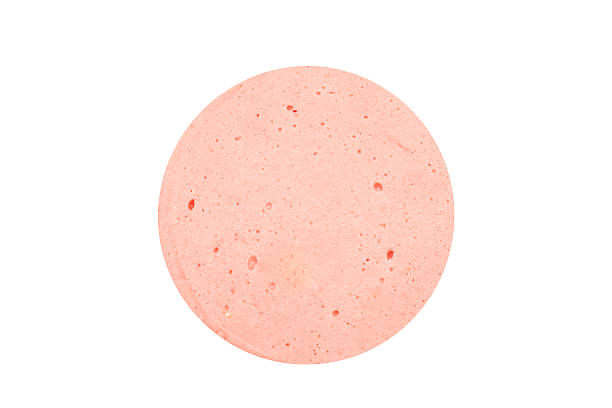 Cтоковое фото Ветчина колбаса или круглые bologna ломтика изолированные на белом backgroun