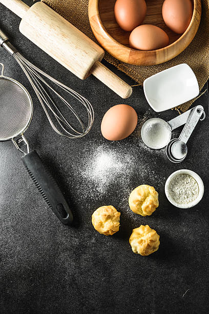 istock Kitchen utensils and baking ingredients on black background, copy-space. 491185548