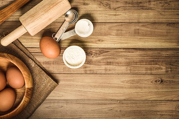istock Kitchen utensils and baking ingredients on wood background, copy-space. 491188030