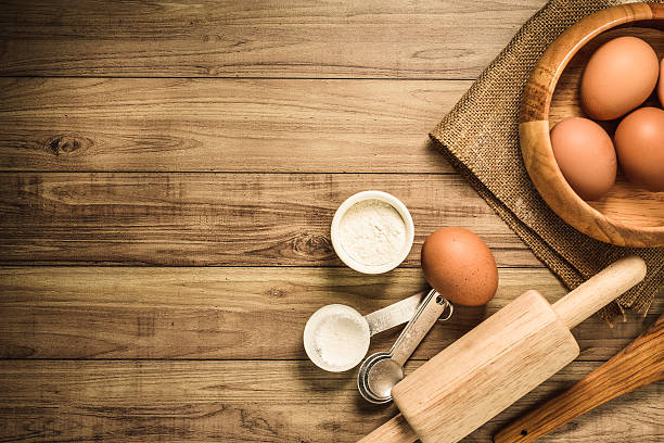 istock Kitchen utensils and baking ingredients on wood background, copy-space. 491188492