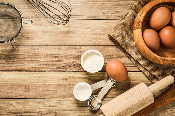 istock Kitchen utensils and baking ingredients on wood background, copy-space. 491188880