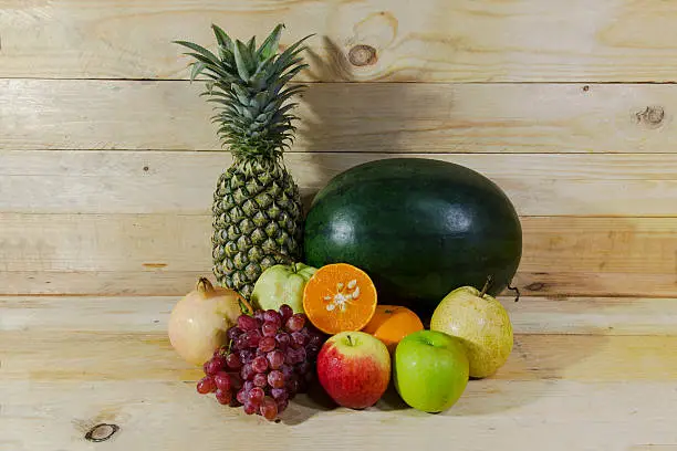 all fruit with wood background