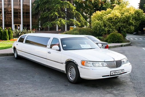 Sochi, Russia - July 19, 2009: White limousine Lincoln Town Car is parked at the city street.