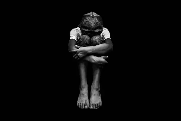Young Asian boy, scared and alone. Hoping for a better future than the one that seems set. He is at high risk of being physically, mentally and emotionally abused and also trafficked.