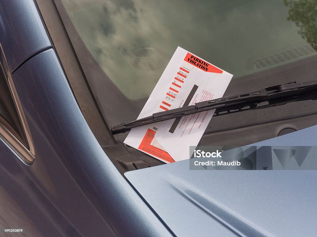 parking ticket parking ticket violation on motor car windscreen or windshield.  Parking Ticket Stock Photo