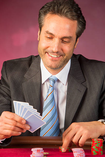 istock Businessman Playing Blackjack In Casino 491204765