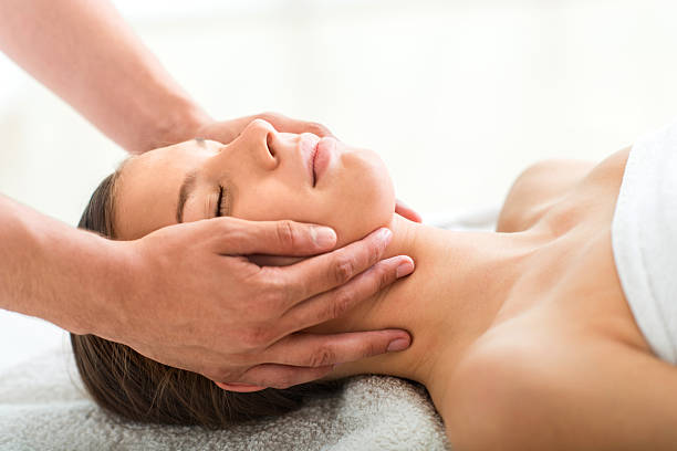istock Young woman getting facial massage at spa. 491204966