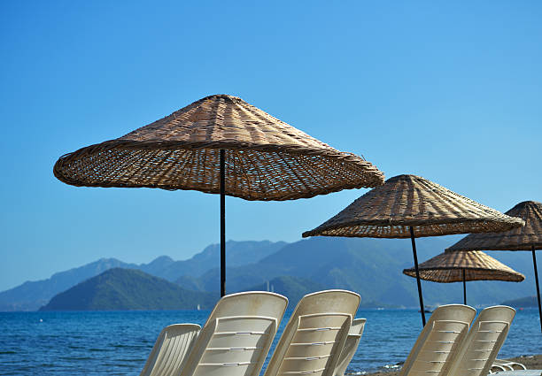 istock Beach umbrellas against the sea 491205027