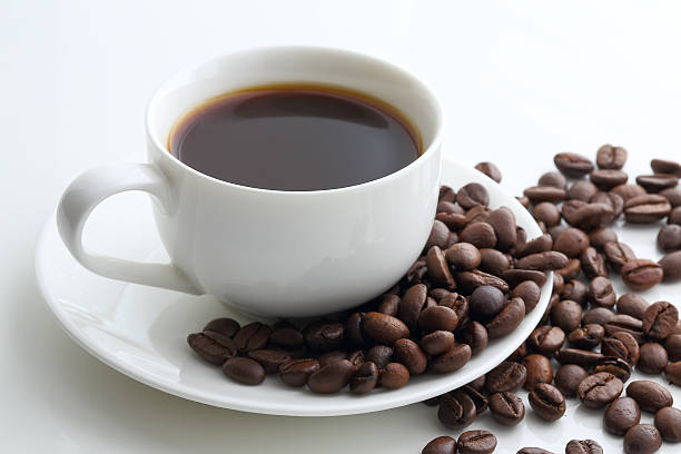istock cup of coffee and coffee beans on a white 491206274