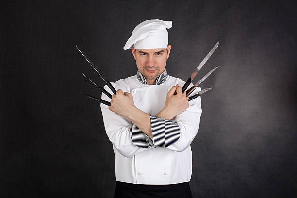 Chef avec knifes Bras croisés - Photo