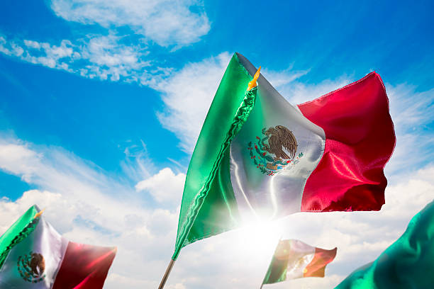 istock Mexican flag against a bright sky, independence day 491206673
