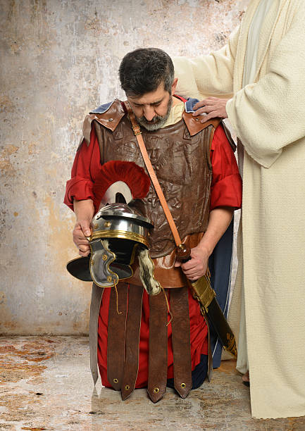 Jesus and Roman Centurion Jesus laying hands on Roman Centurion roman centurion stock pictures, royalty-free photos & images