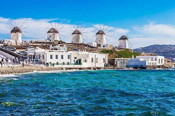 The famous Mykonos windmills Two of the famous windmills in Mykonos, Greece during a clear and bright summer sunny day mykonos photos stock pictures, royalty-free photos & images