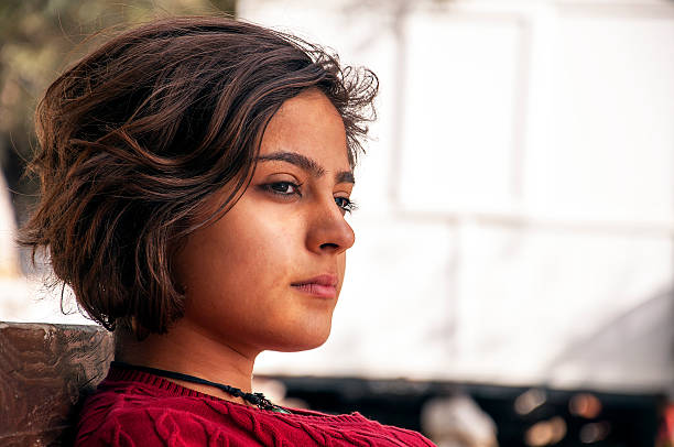 There are thoughtful  young lady. Young woman is thinking.