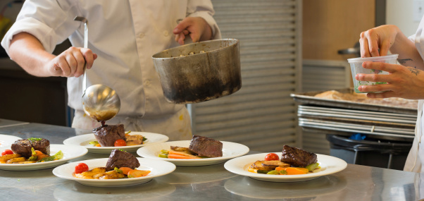 Chefs Plating a Grilled Beef Tenderloin dish