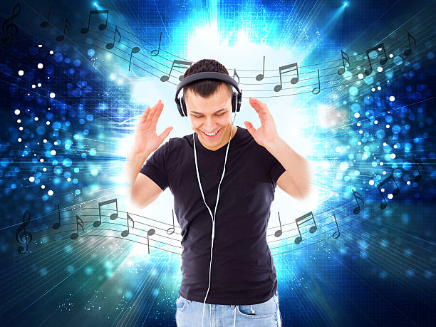casual handsome man with headphones and notes all around him