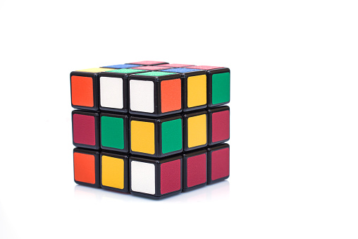 Paris, France - September 29, 2015: Rubik's cube on the white background. This famous game was invented by a Hungarian architect Erno Rubik in 1974.