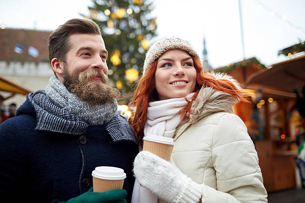 istock happy couple drinking coffee on old town street 491218364