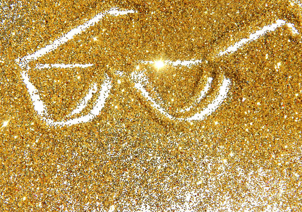 istock Sunglasses of golden glitter sparkle on white background 491219002