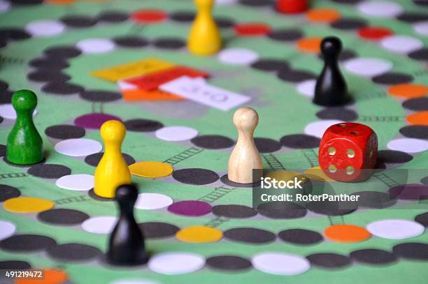 Family Game Evening With Self Made Boardgame Stock Photo - Download Image Now - Board Game, Leisure Games, Playful