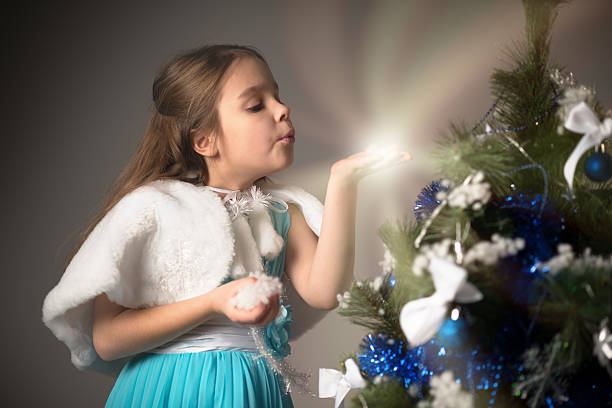 portrait of Snow Maiden in a traditional costume with a kokoshnik on a white background. The concept of Russian New Year's traditions. Congratulations to children.