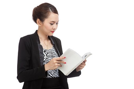 Young Asian business woman with a book  isolated on white background