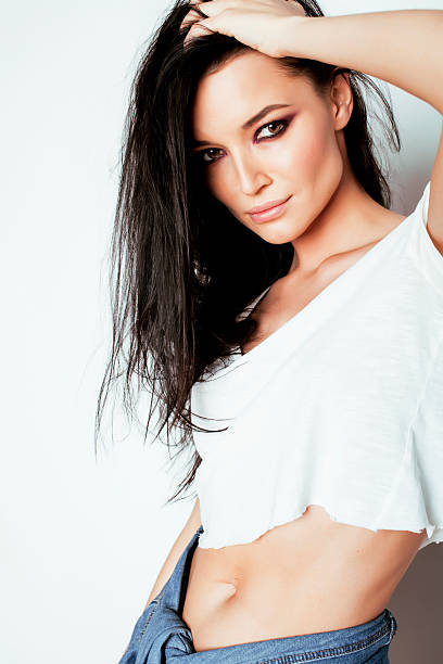 istock young emotional brunette woman posing against white background 491221592
