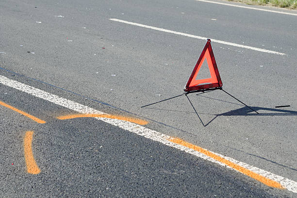 istock Warning triangle on the road after the car crash 491221654