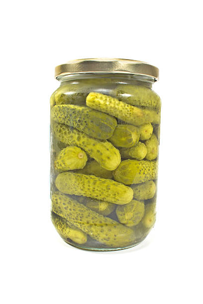 istock Pickled cucumbers in jar isolated on white 491222196