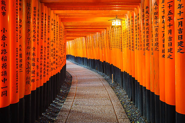 Torii gates in Fushimi Inari Shrine, Kyoto, Japan Kyoto, Japan - March 29, 2015: Torii gates in Fushimi Inari Shrine. kyoto prefecture stock pictures, royalty-free photos & images