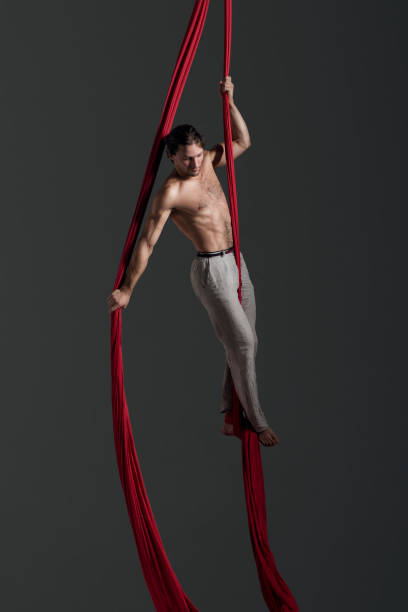 istock Man performing aerial silk dance 491223688