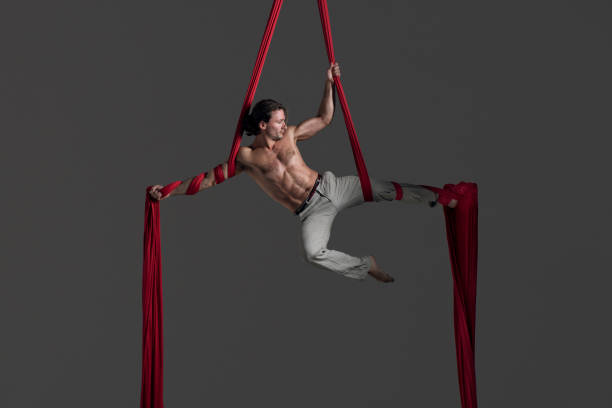 istock Man performing aerial silk dance 491223900