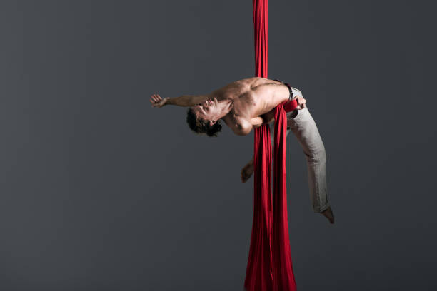 istock Man performing aerial silk dance 491224066