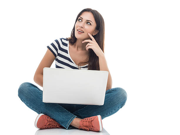 istock Young woman with laptop on white 491229850