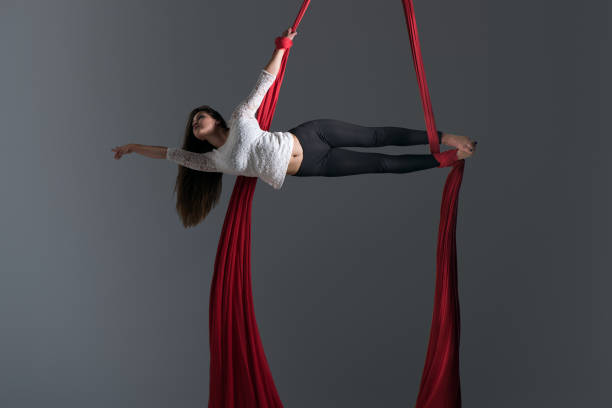 istock Girl performing aerial silk dance 491230322