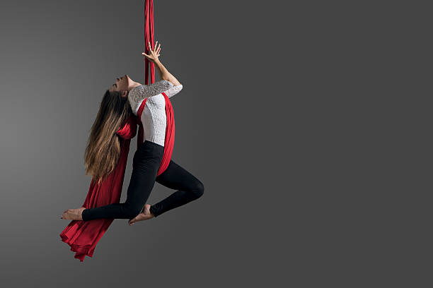 Girl performing aerial silk dance stock photo