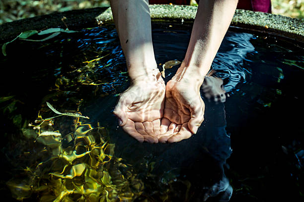 istock Holding water from a well  in cupped hands 491232234