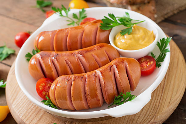istock Sausages on the grill with mustard on a platter 491234142