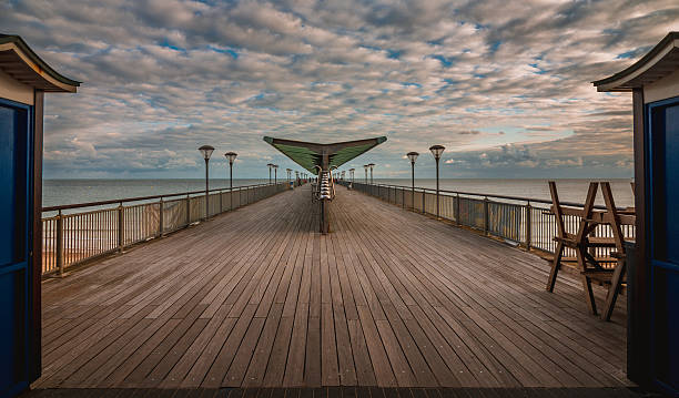 Pier at sunset This is Boscombe pier in Dorset United kingdom. as the sun was setting it light up the pier like a 1960's stage show was about to be performed.  boscombe photos stock pictures, royalty-free photos & images