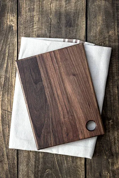 Empty cutting board on napkin , from above