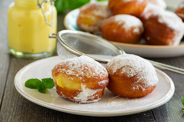 istock With vanilla cream donuts in powdered sugar. 491242737