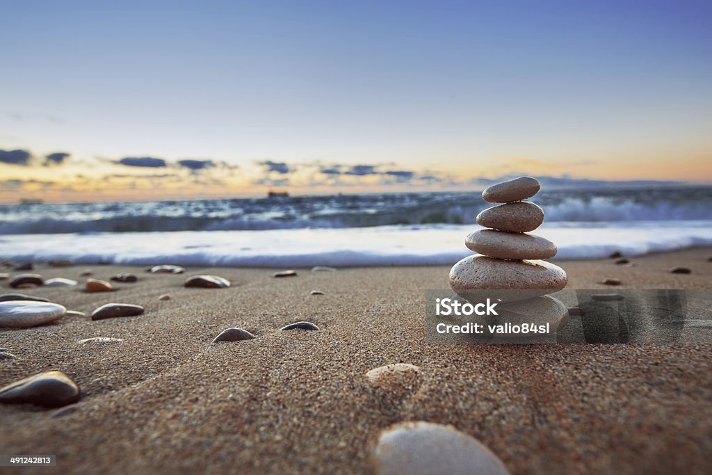 Stones balance Stones balance on beach, sunrise shot Zen-like Stock Photo